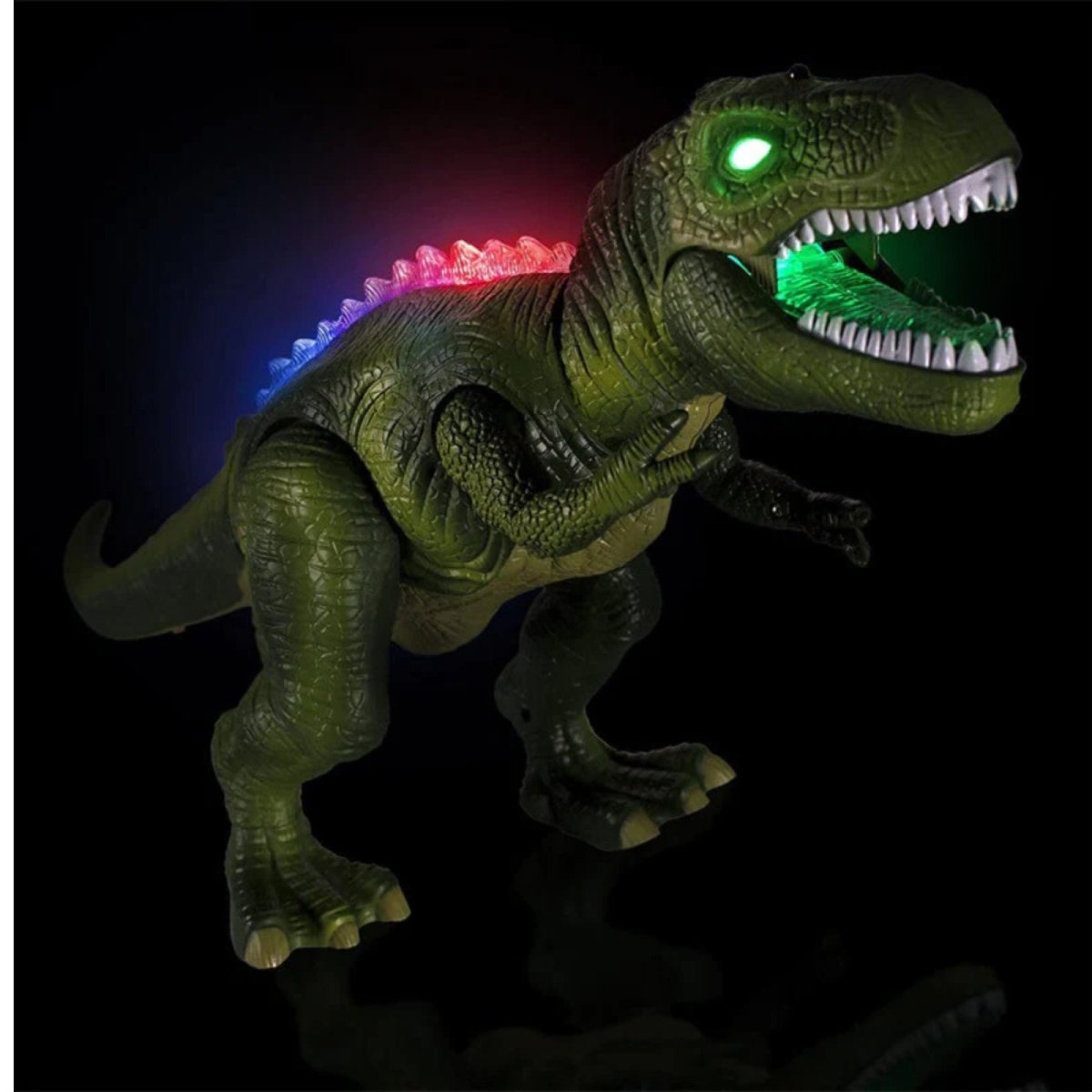 The green Kouvr T-Rex dinosaur toy shown in the dark to highlight its glowing green eyes, light-up mouth, and multi-color red, blue, and green LED back spines.
