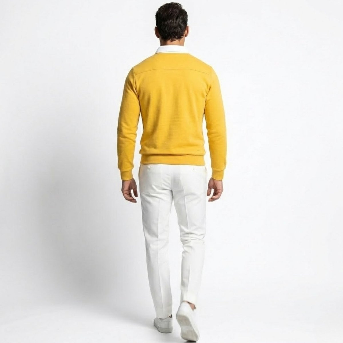Back view of the Kouvr men's yellow polo sweater, highlighting the back yoke seam detail and fit across the shoulders.