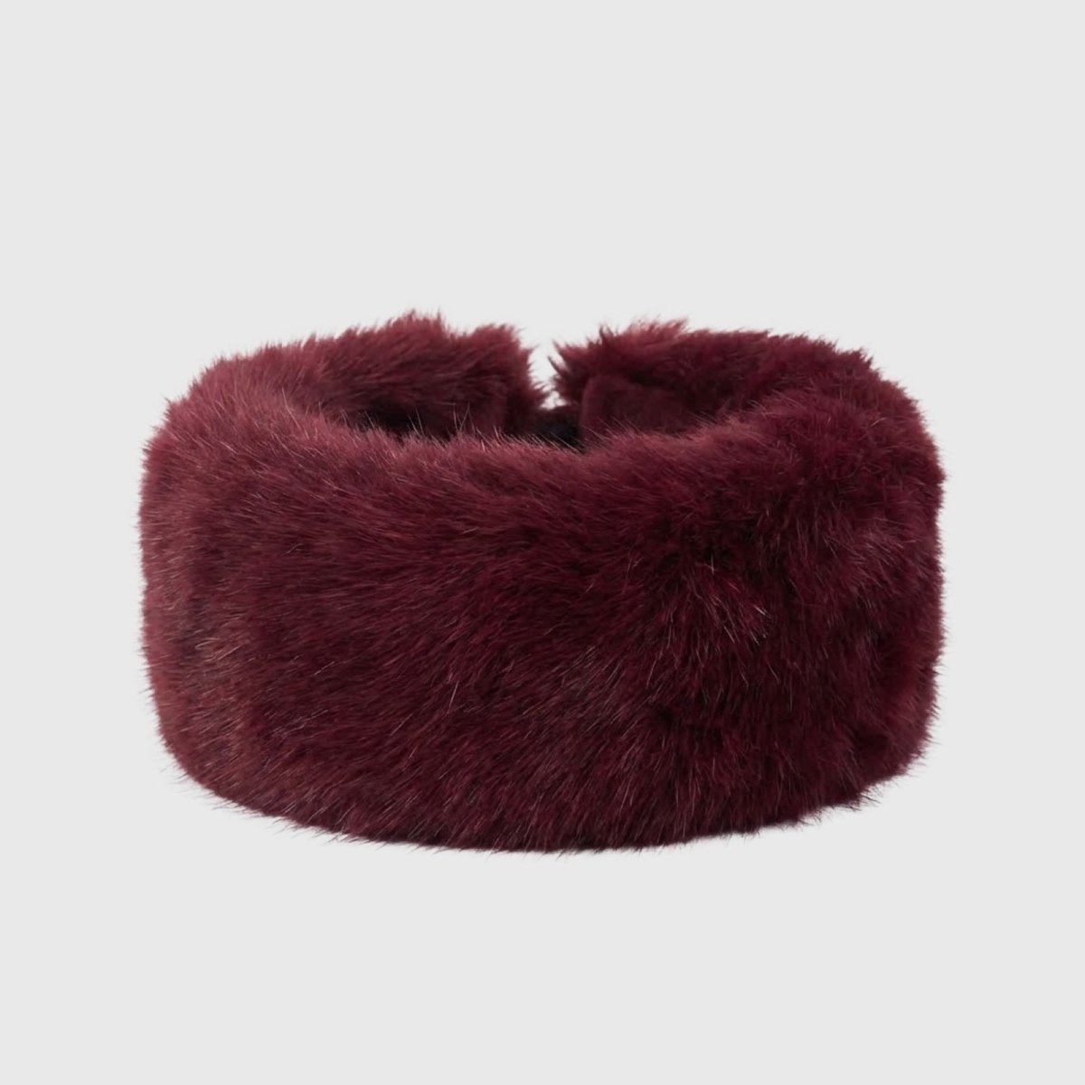 Product-only shot of the Kouvr Nancie soft burgundy faux fur headband on a white background.