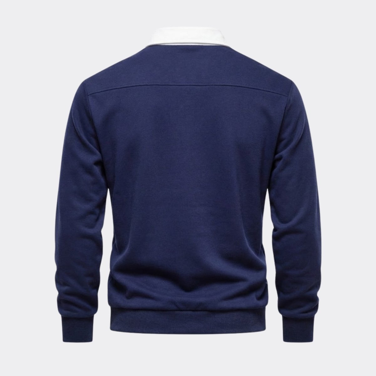 Back product shot of the Kouvr navy polo, detailing the horizontal yoke seam across the shoulders and quality construction.