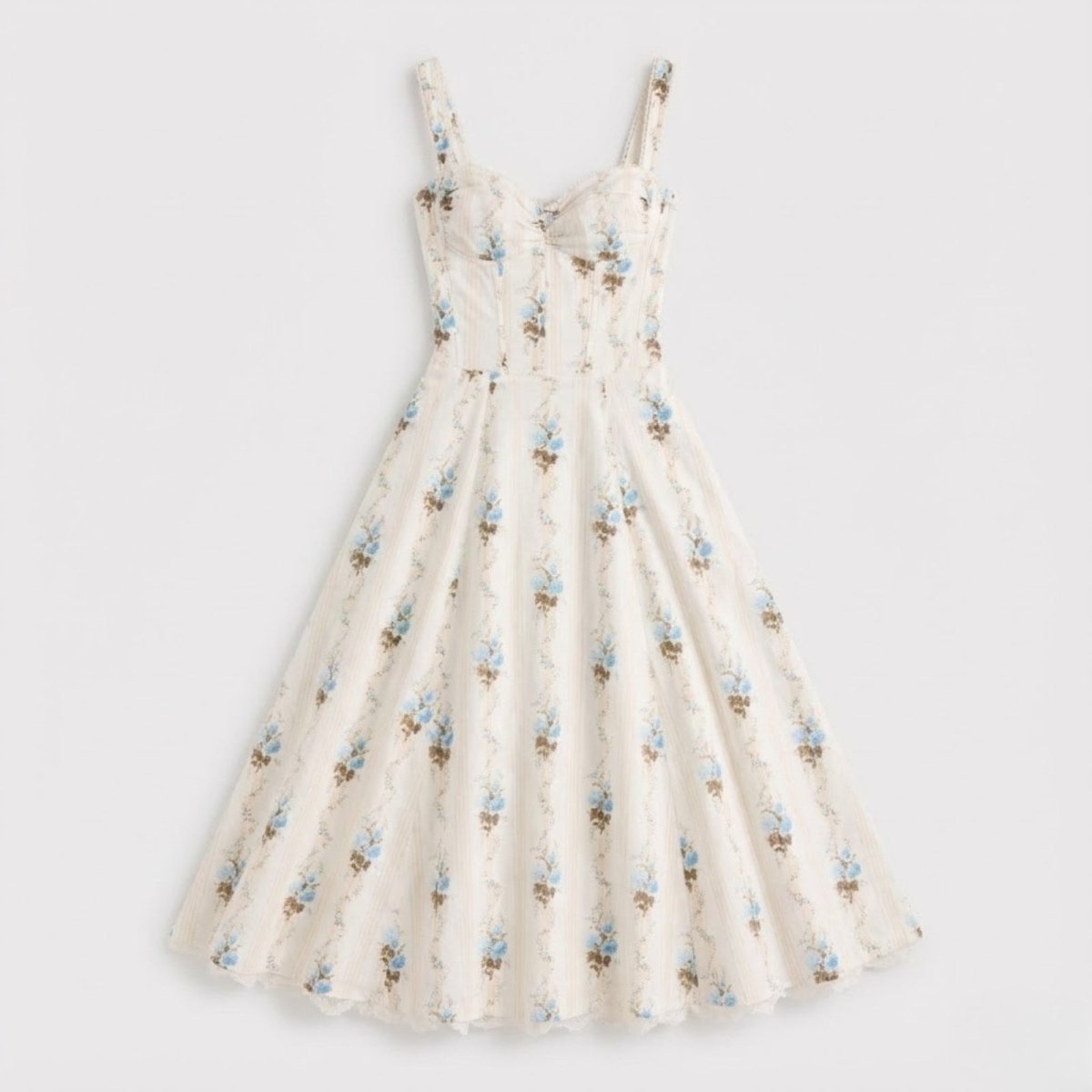 Flat lay of the Nefeli cream floral corset midi dress, highlighting the structured bodice, sweetheart neckline, and all-over blue floral and stripe pattern.