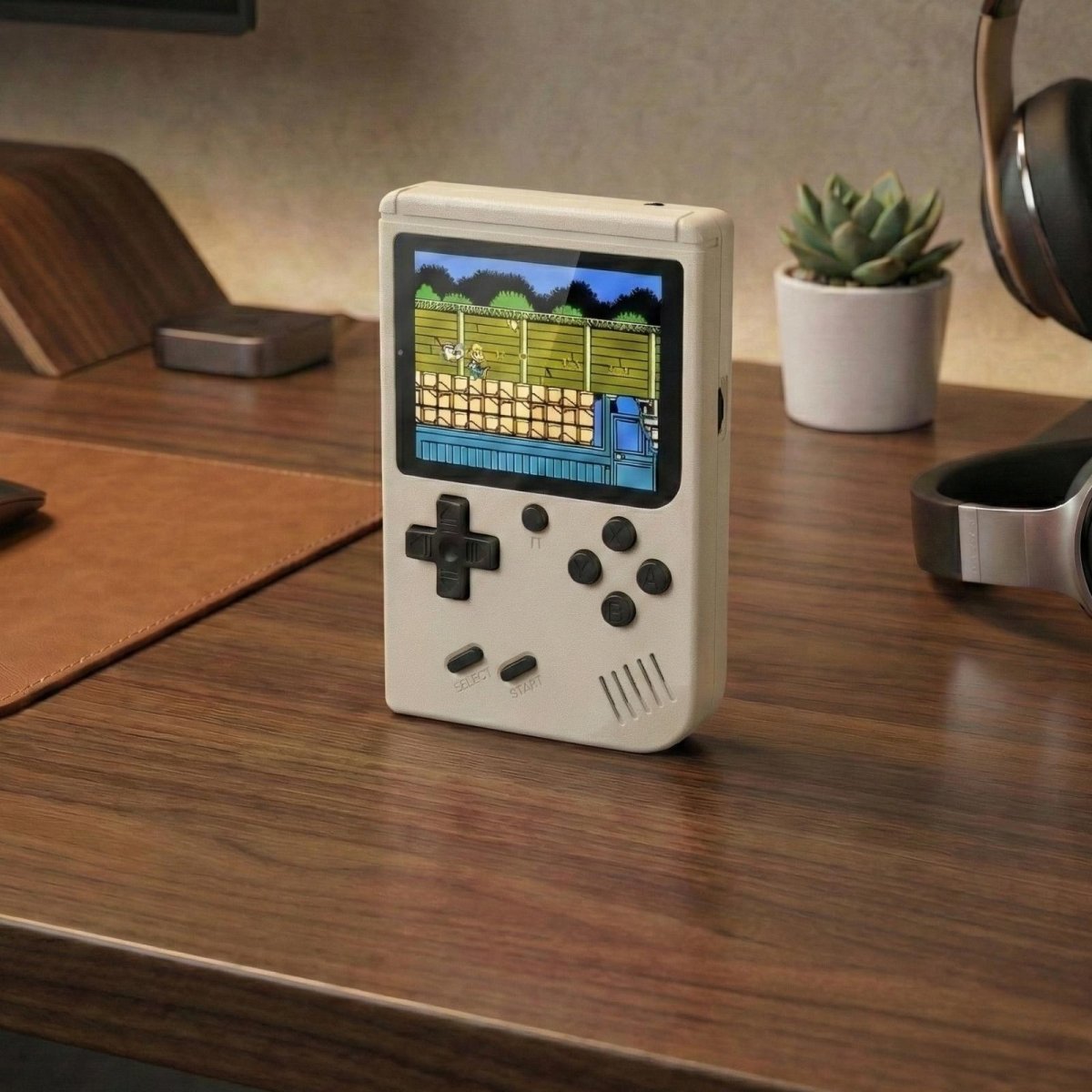 Kouvr portable vintage gaming console in white, standing upright on a wooden desk, ready for play.