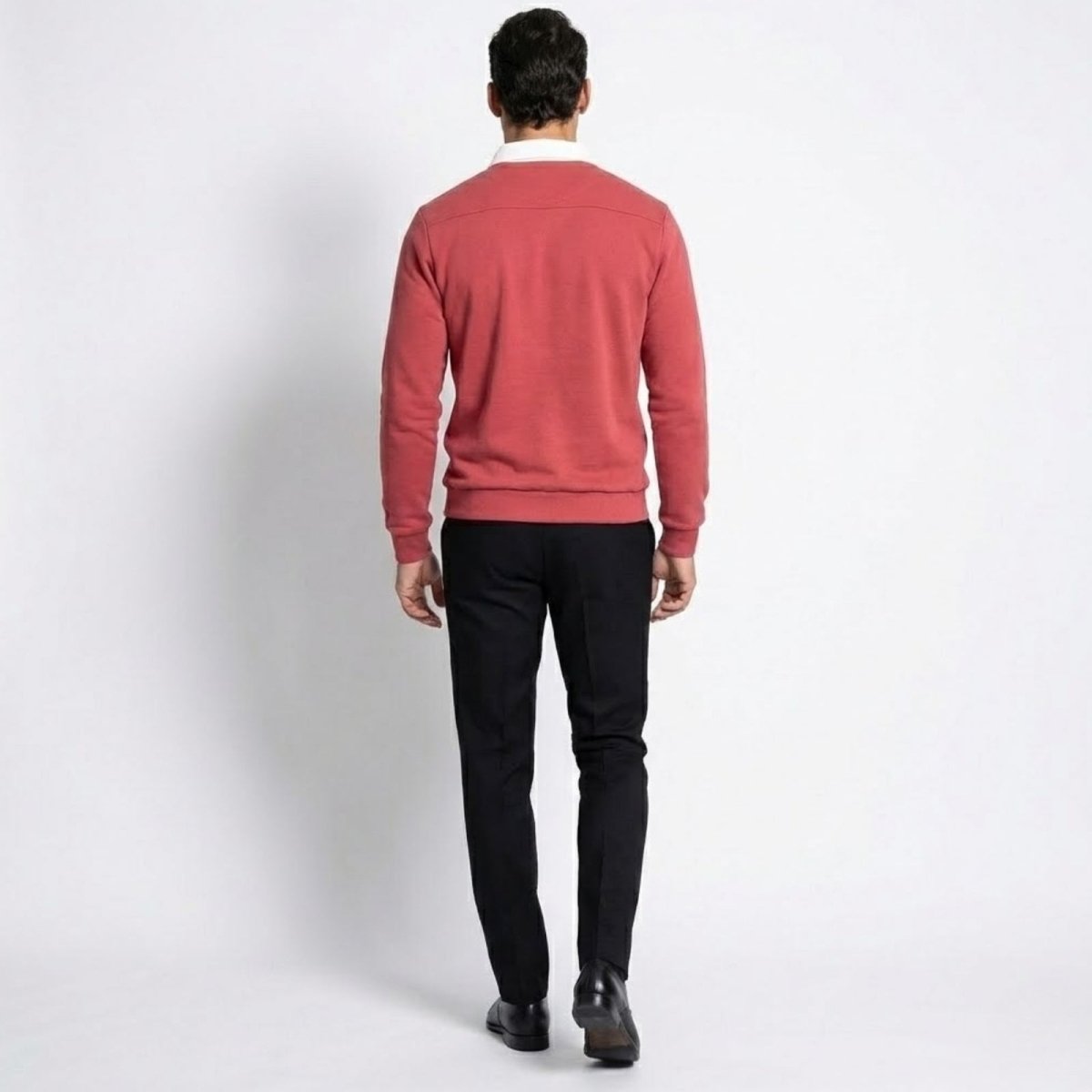 Back view of the Kouvr Rhodes polo sweater in rosewood red, showing shoulder seam detail.