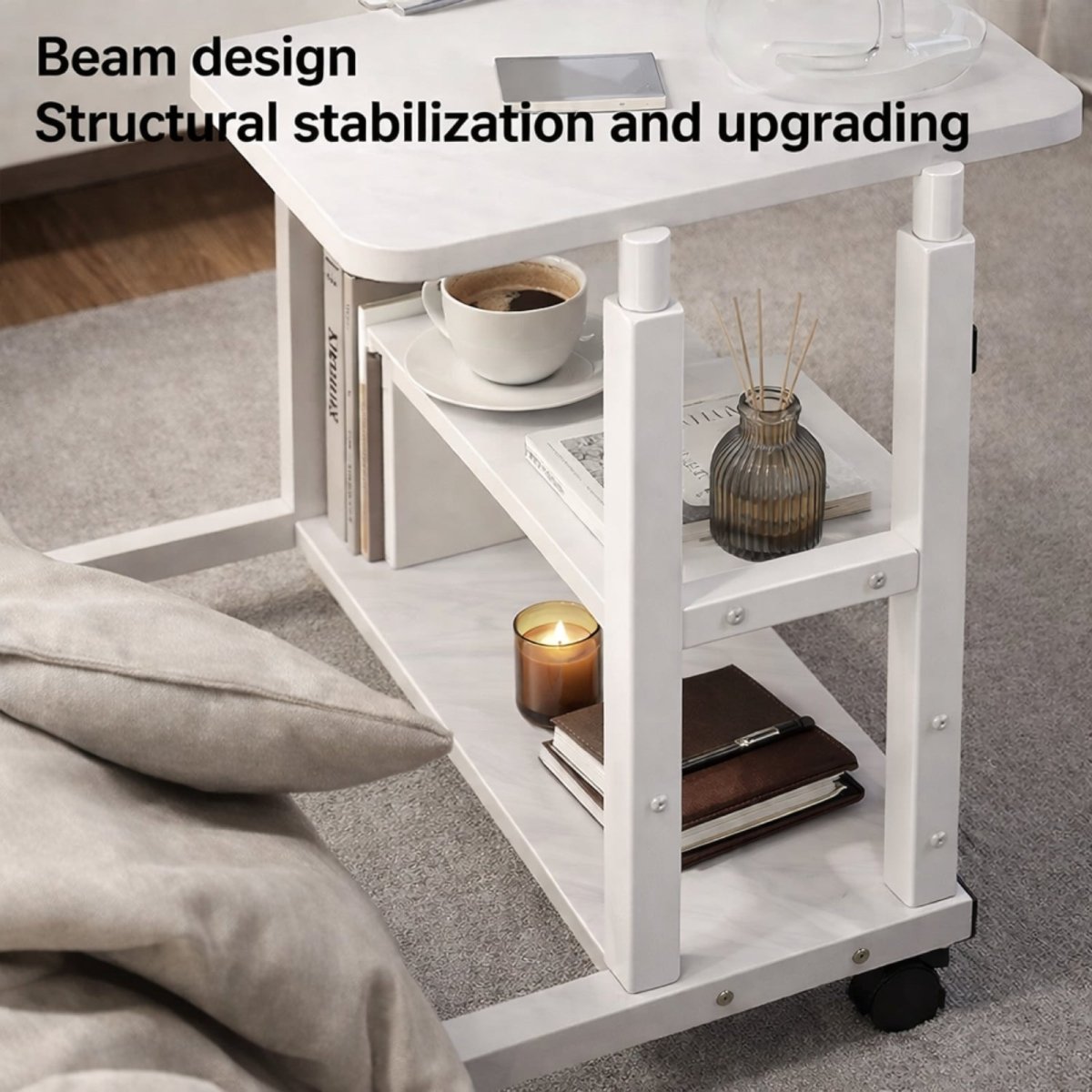 Close-up view of the shelving and sturdy beam design of the white rolling desk, showcasing its structural stability with books, a candle, and a diffuser.