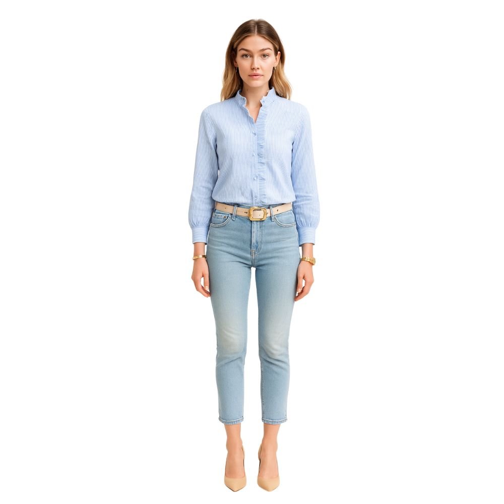 Model wearing the Kouvr Fashion Ruffle Neck Blouse, tucked into high-waisted light-wash jeans
