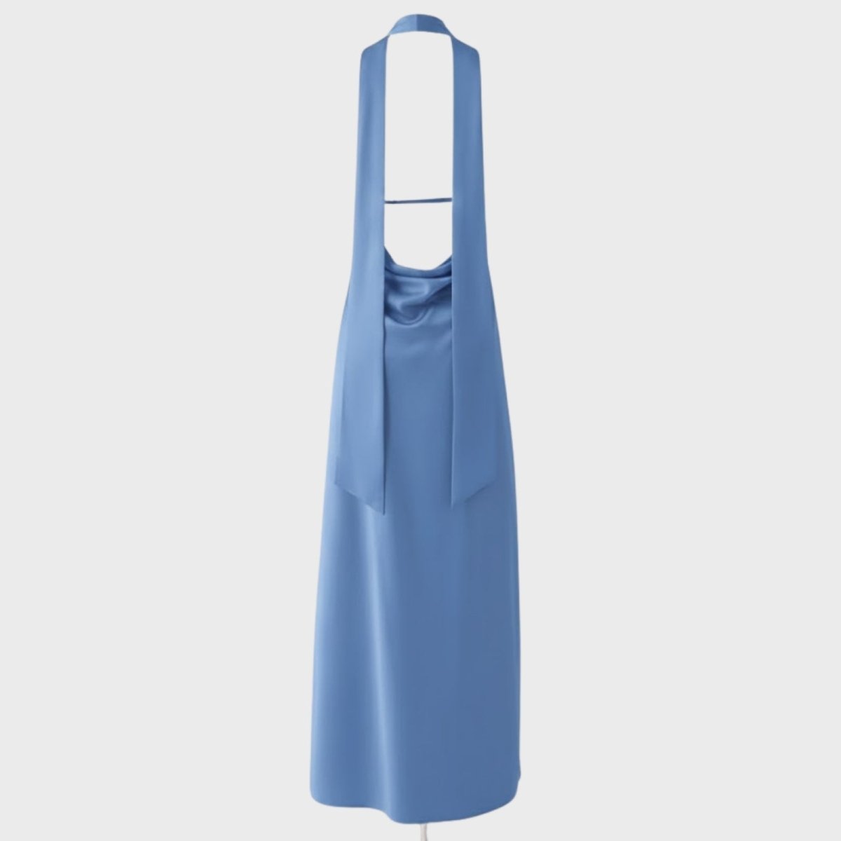 Product flat lay showing the back construction of the Sharon gown, including the open back, cowl detail, and long halter ties.