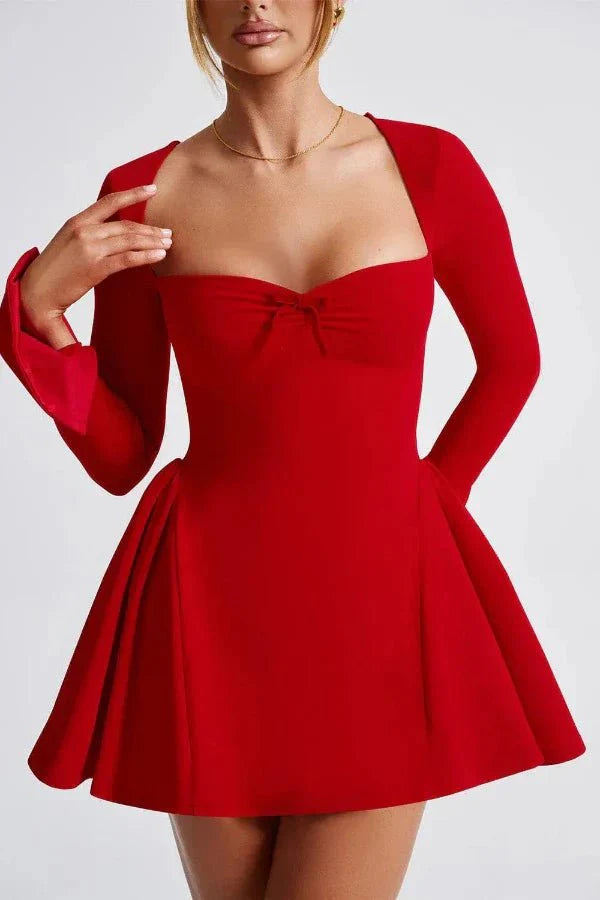 occasionwear," "sculptural dress," "statement piece," "A-line skirt," "cinched waist," and "evening wear