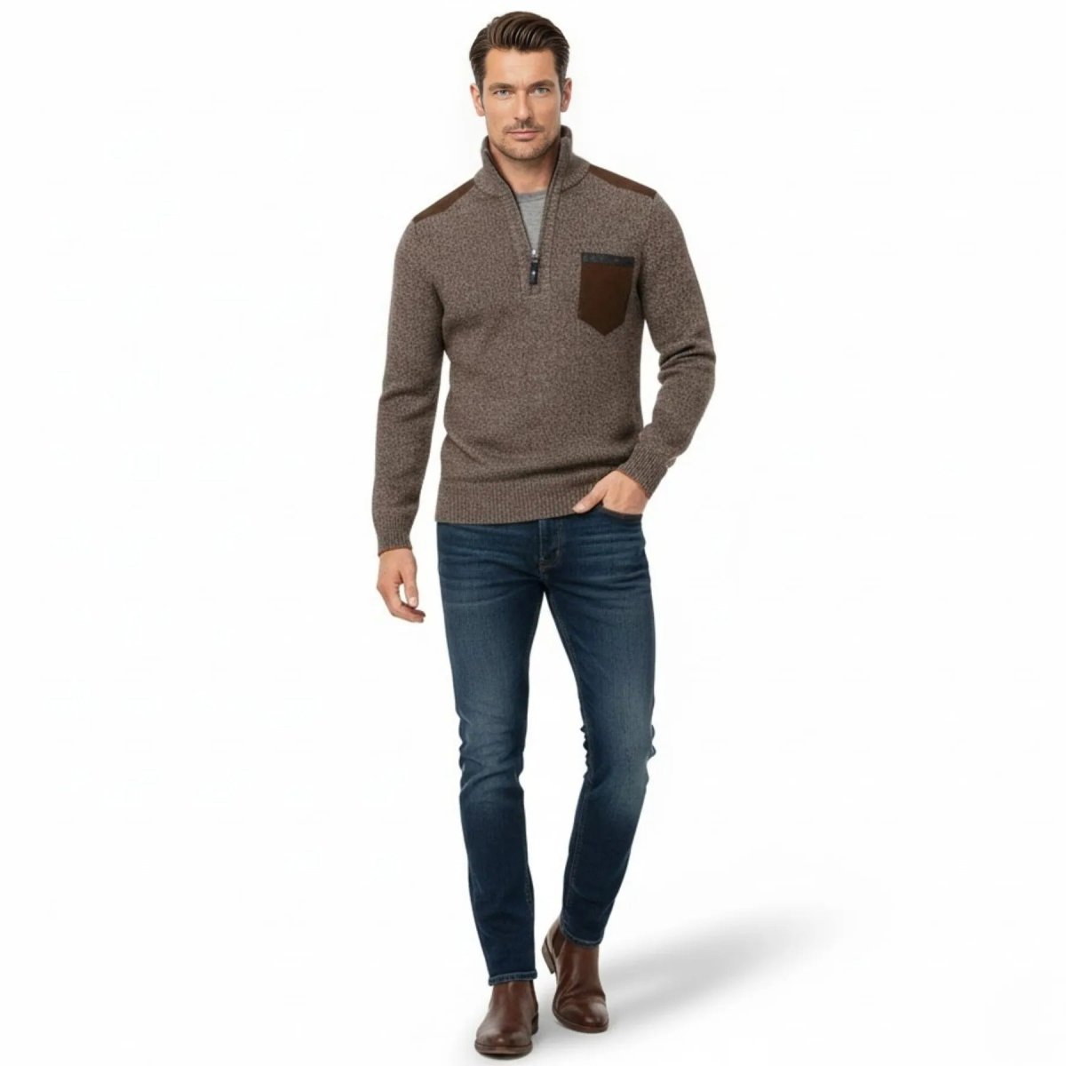 Male model walking in a slim-fit heather brown quarter-zip sweater with brown suede shoulder patches and chest pocket, paired with dark blue jeans and brown boots.