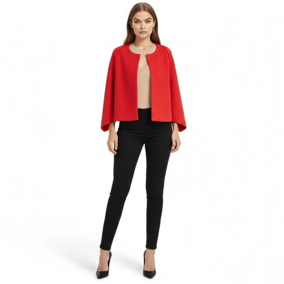 Model wearing the Kouvr structured red cape jacket, styled with black pants and a nude top.