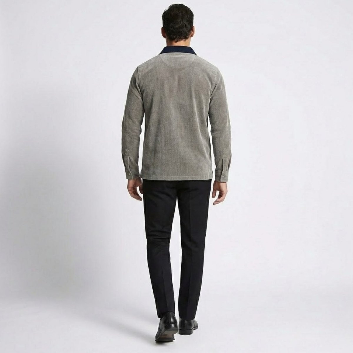 Back view of the Kouvr Zain grey corduroy long sleeve polo shirt, highlighting the contrast collar and tailored silhouette.