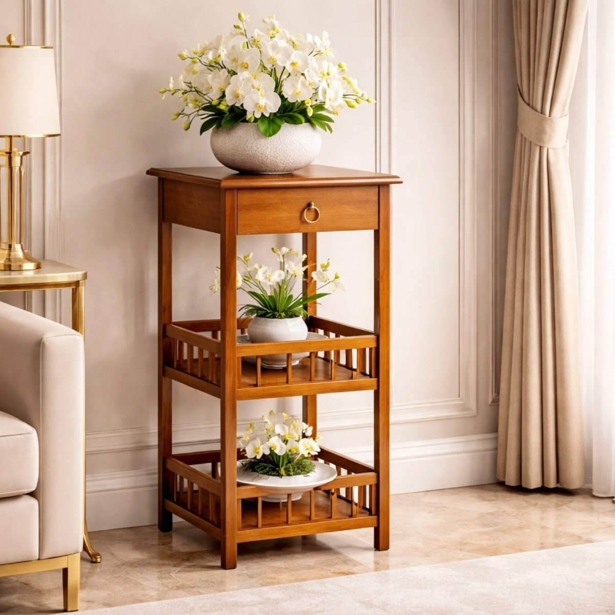 A close-up lifestyle shot of the tall Kouvr side table decorated with white orchids in a bright, elegant living room.
