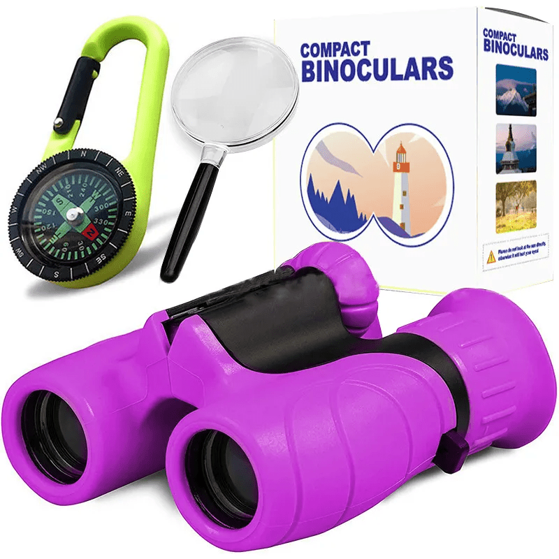 Purple compact binoculars for girls and boys featuring a matching purple compass and handheld magnifying glass for backyard exploration.