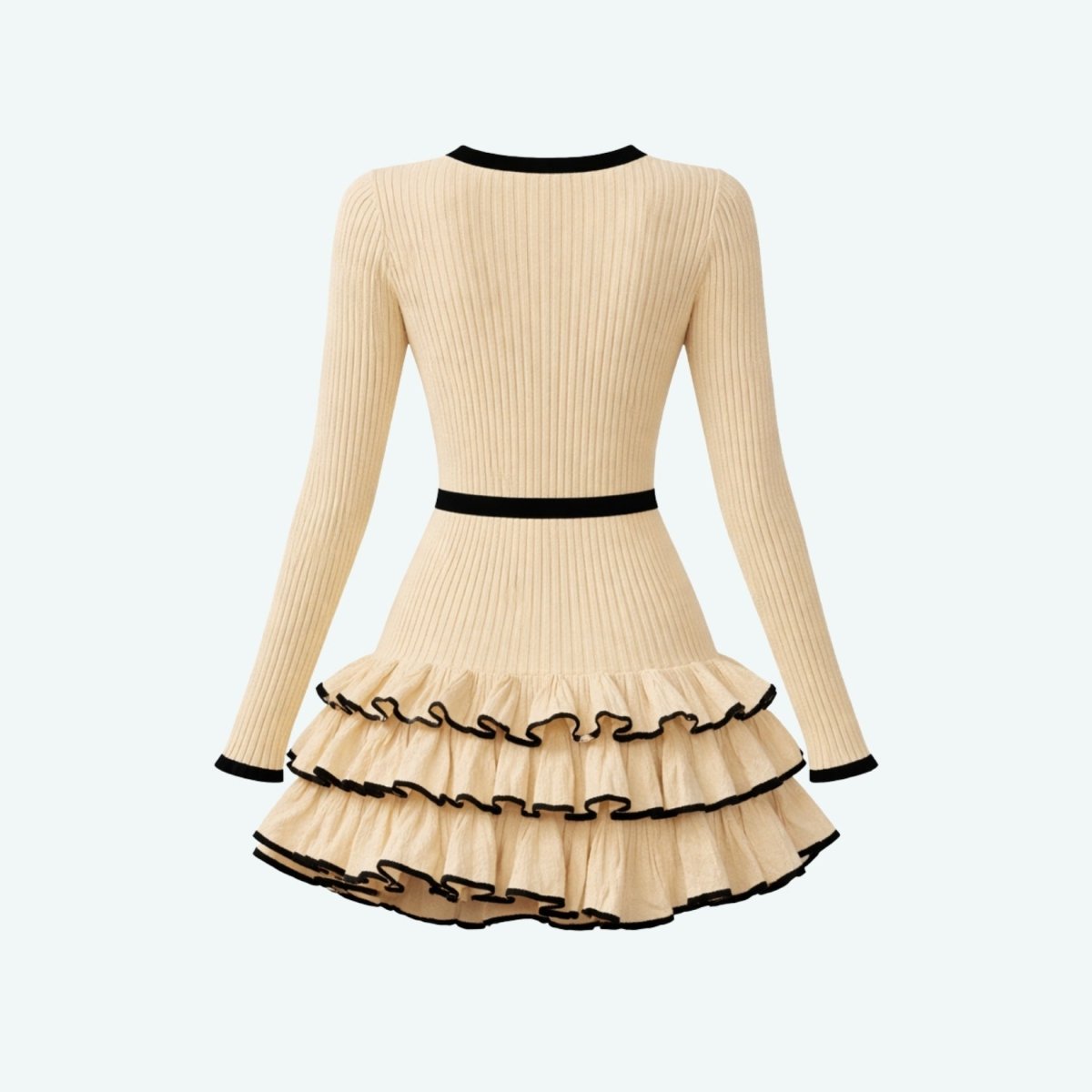 Flat lay back view of a beige and black knit ruffle mini dress highlighting the ribbed texture and contrast borders.