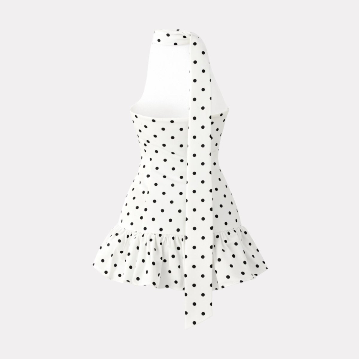 Rear view of a designer polka dot halter mini dress highlighting the backless design and long neck sash.
