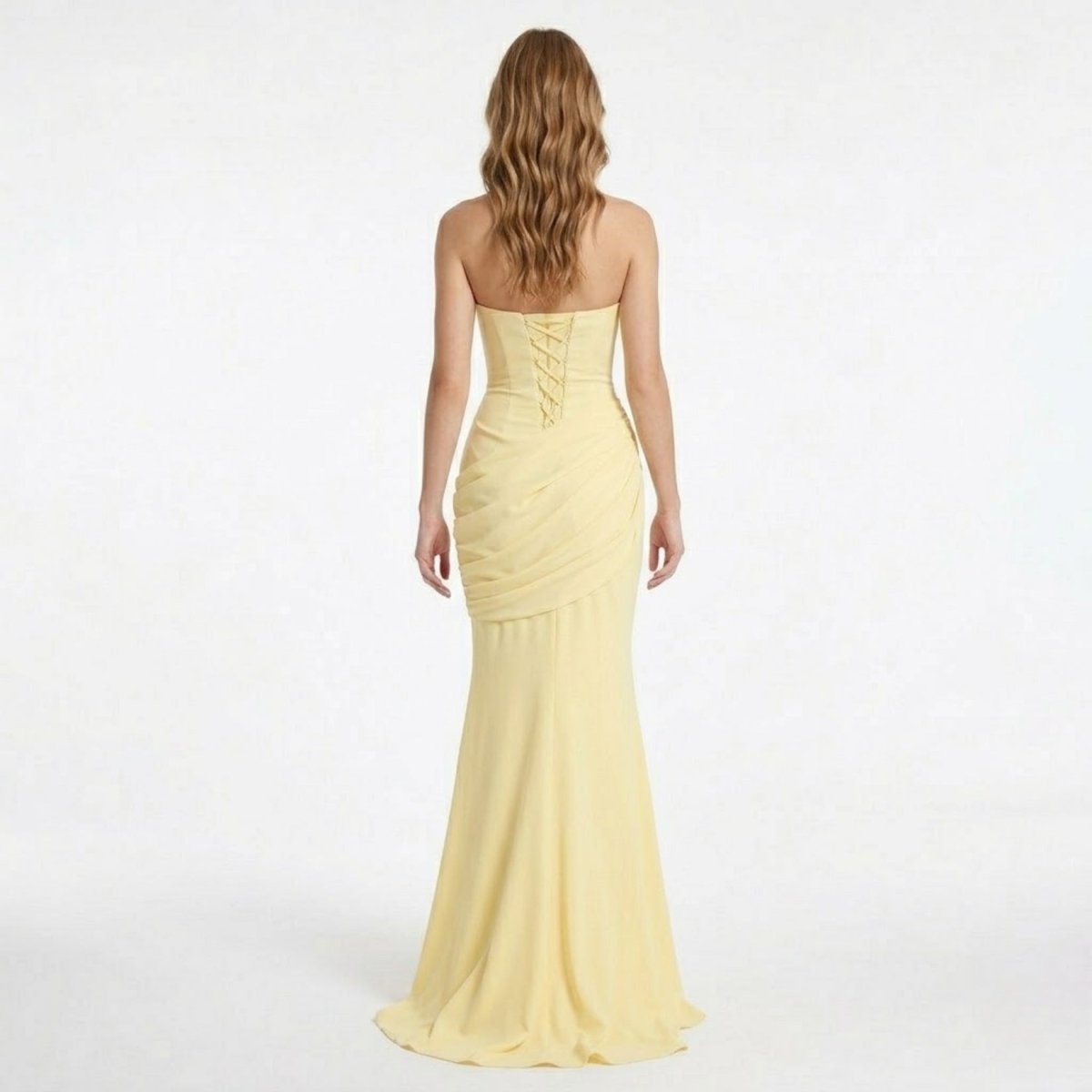 Back view of the Kouvr yellow prom dress showcasing the stunning open back with an adjustable lace-up corset closure.