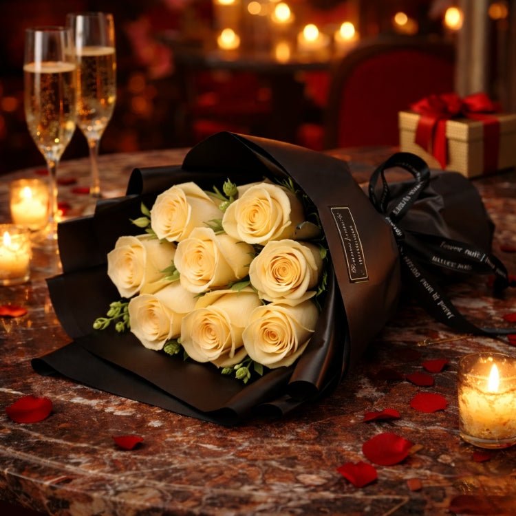 A bouquet of champagne-colored everlasting roses from Kouvr, held against a romantic Paris backdrop, perfect for an anniversary gift.
