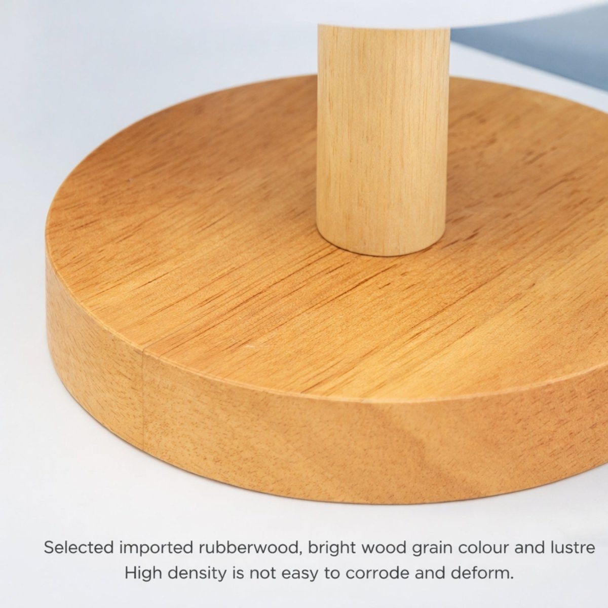 Close up detail of the premium, high-density imported rubberwood base used on Kouvr luxury table lamps, showcasing natural bright wood grain.
