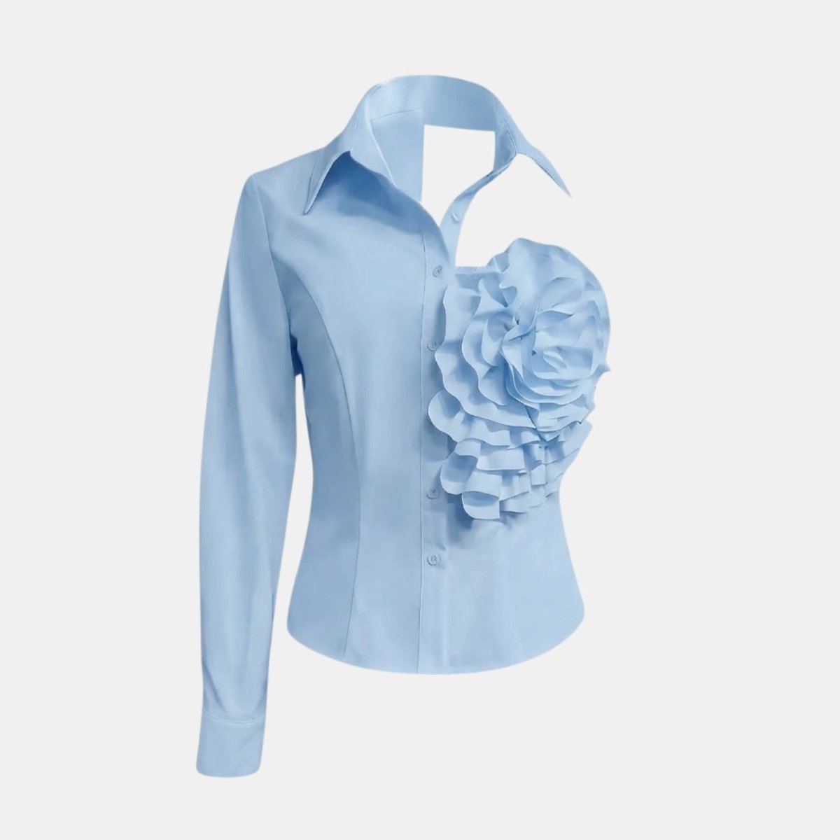 Product-only image of the Kouvr light blue one-shoulder shirt against a white background, detailing the 3D floral appliqué.
