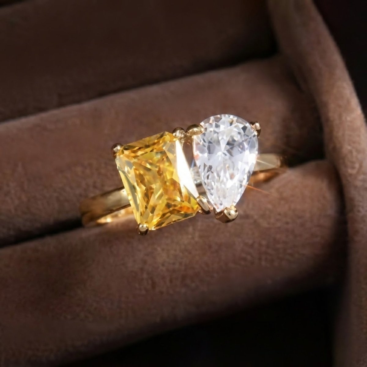 The Kouvr Soleil Toi et Moi ring presented in a luxurious brown velvet ring box, perfect for gifting.
