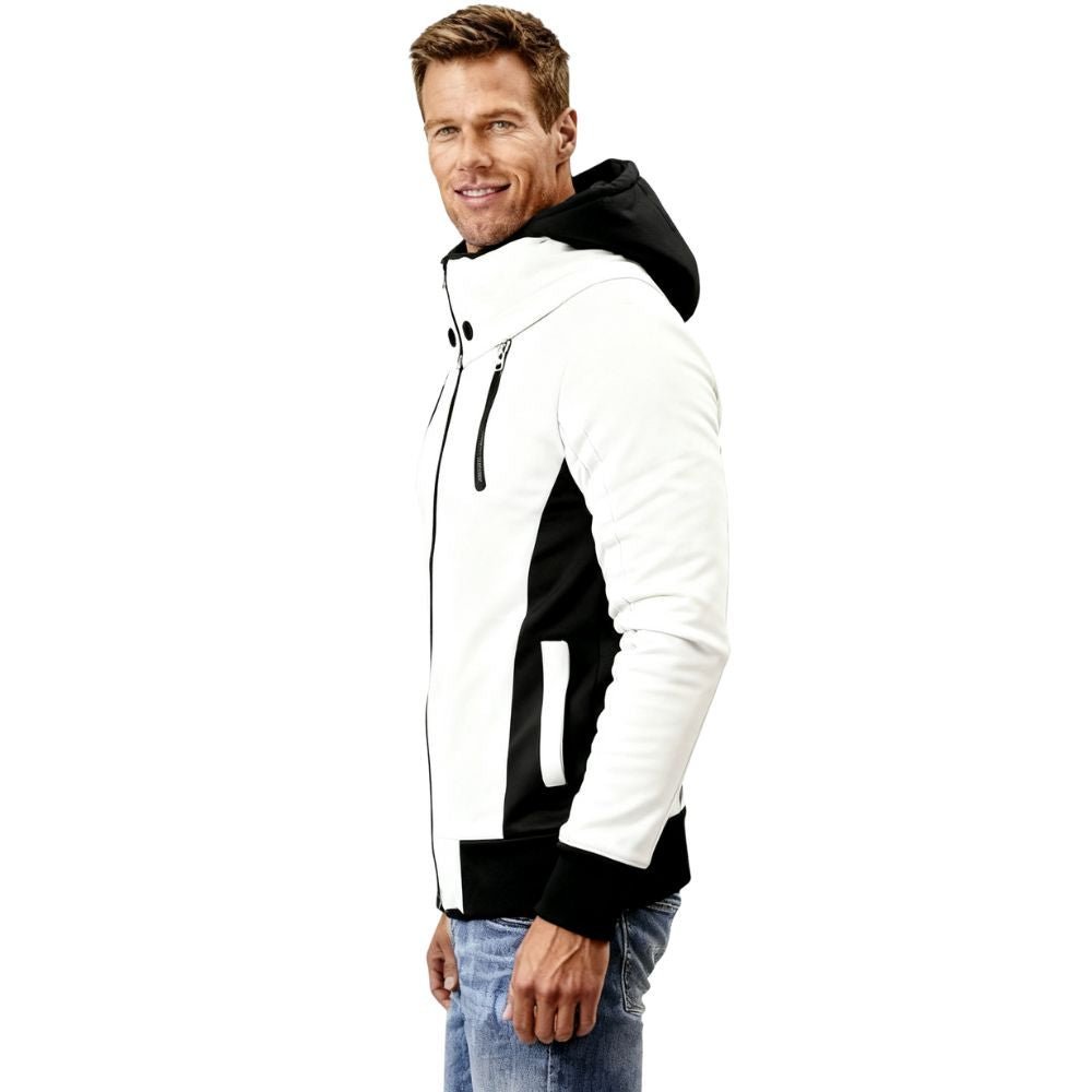 Man wearing a black and white kouvr jacket on a white background