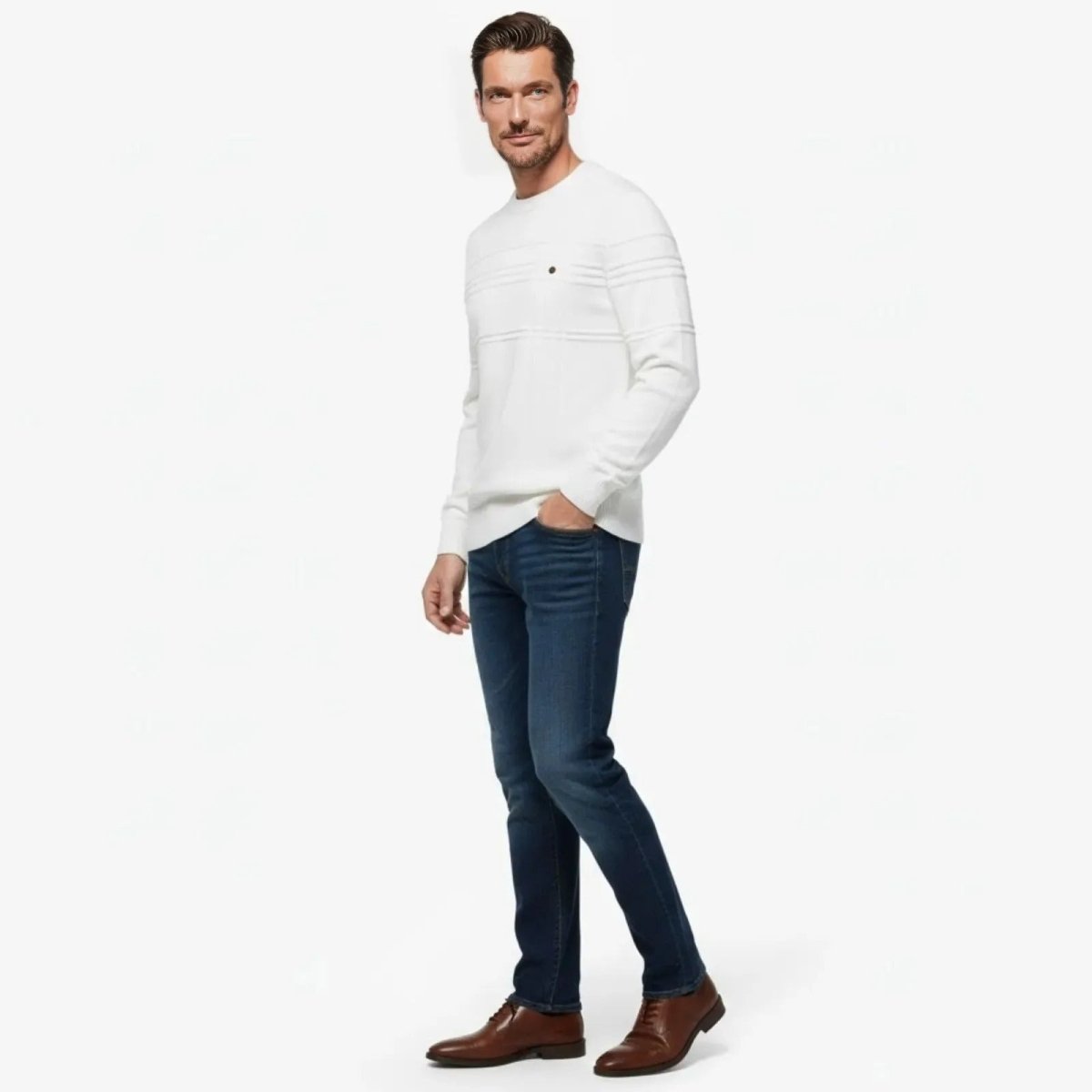 Side view of a man in a white Kouvr structured sweater, showcasing the slim fit and moto-style sleeve detailing.