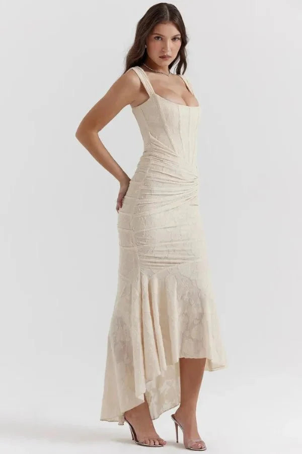 Model wearing the Kouvr Arabella ivory corset midi dress with asymmetrical hem
