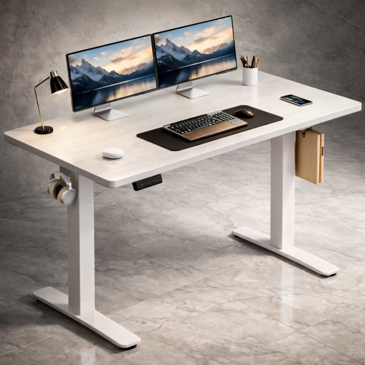 A white marble finish Kouvr electric standing desk with a white frame, shown with a dual monitor setup against a contemporary grey wall.
