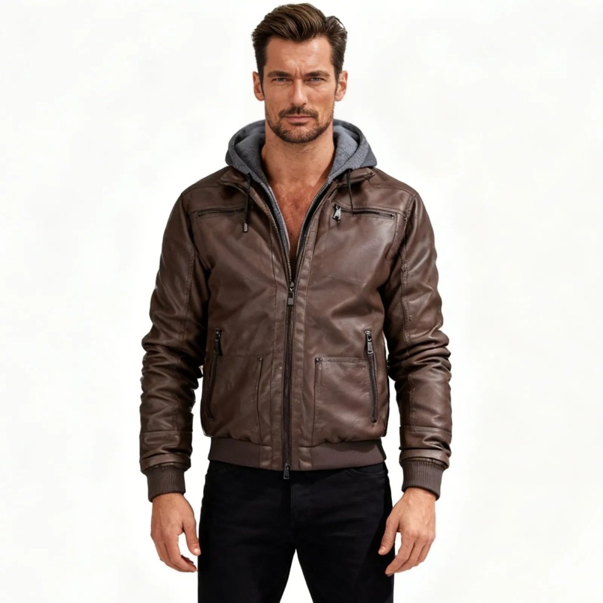 Man wearing the Kouvr Ascend men's brown faux leather jacket with a grey hood, shown from the front against a white background.
