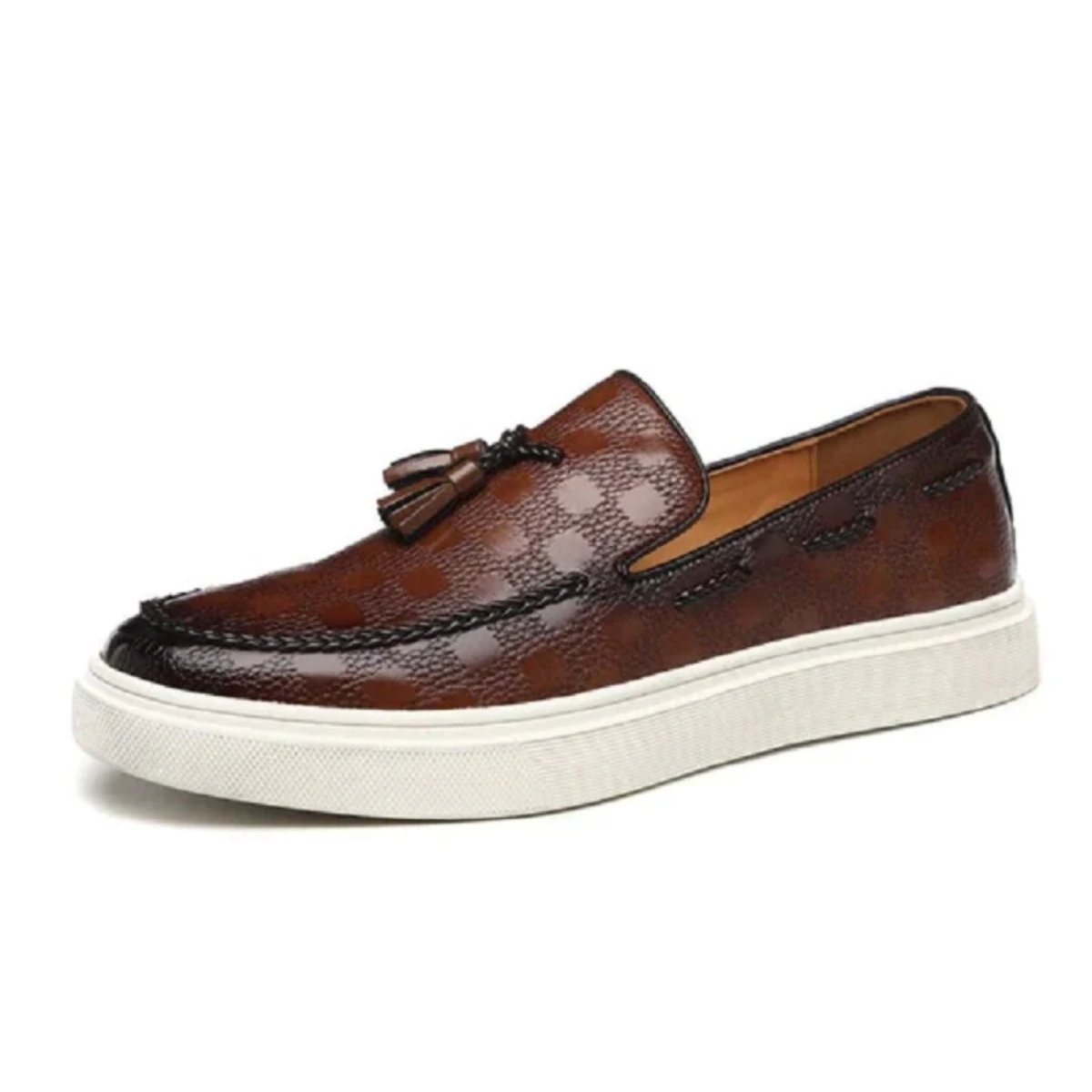 Side profile of the Kouvr Carlo brown leather slip-on loafer showcasing the thick white comfort sole and handcrafted tassel detail.
