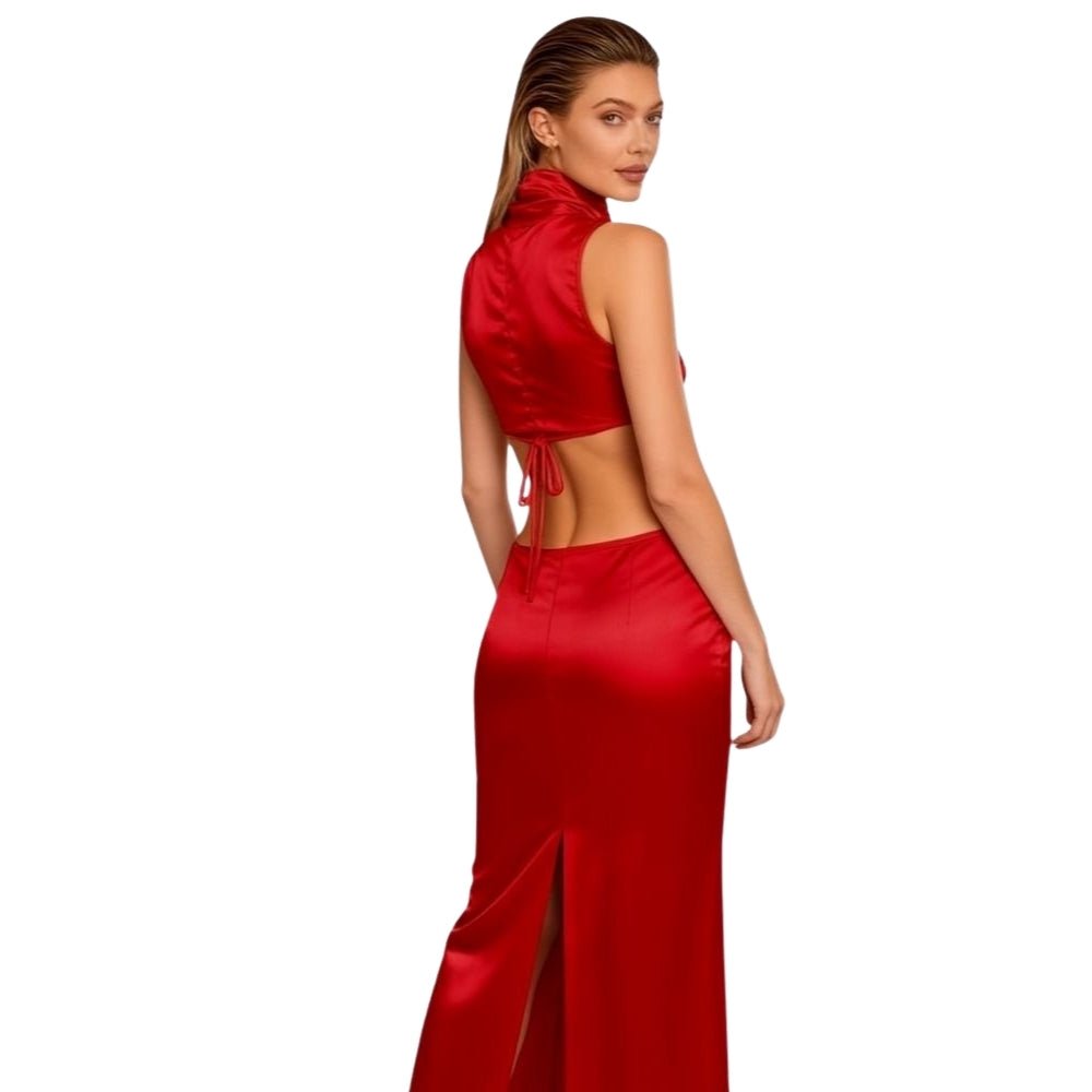 Woman wearing a red Kouvr satin outfit on a white background