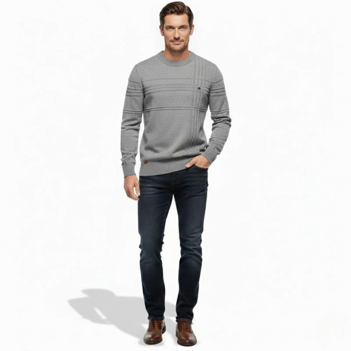 Male model wearing the Kouvr Fashion Ander slim fit textured crewneck sweater in heather grey, paired with dark wash denim jeans.
