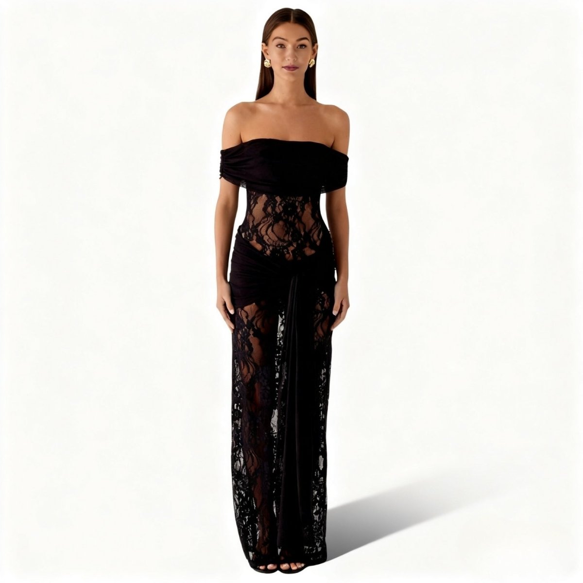Woman wearing a black Kouvr lace off-shoulder gown on a white background