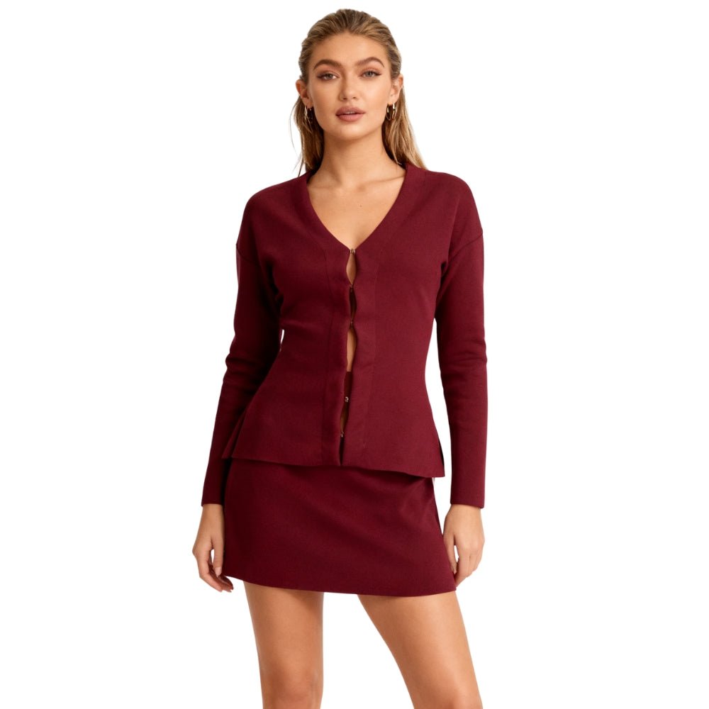 Woman wearing a Burgundy Kouvr cardigan and skirt set on a white background