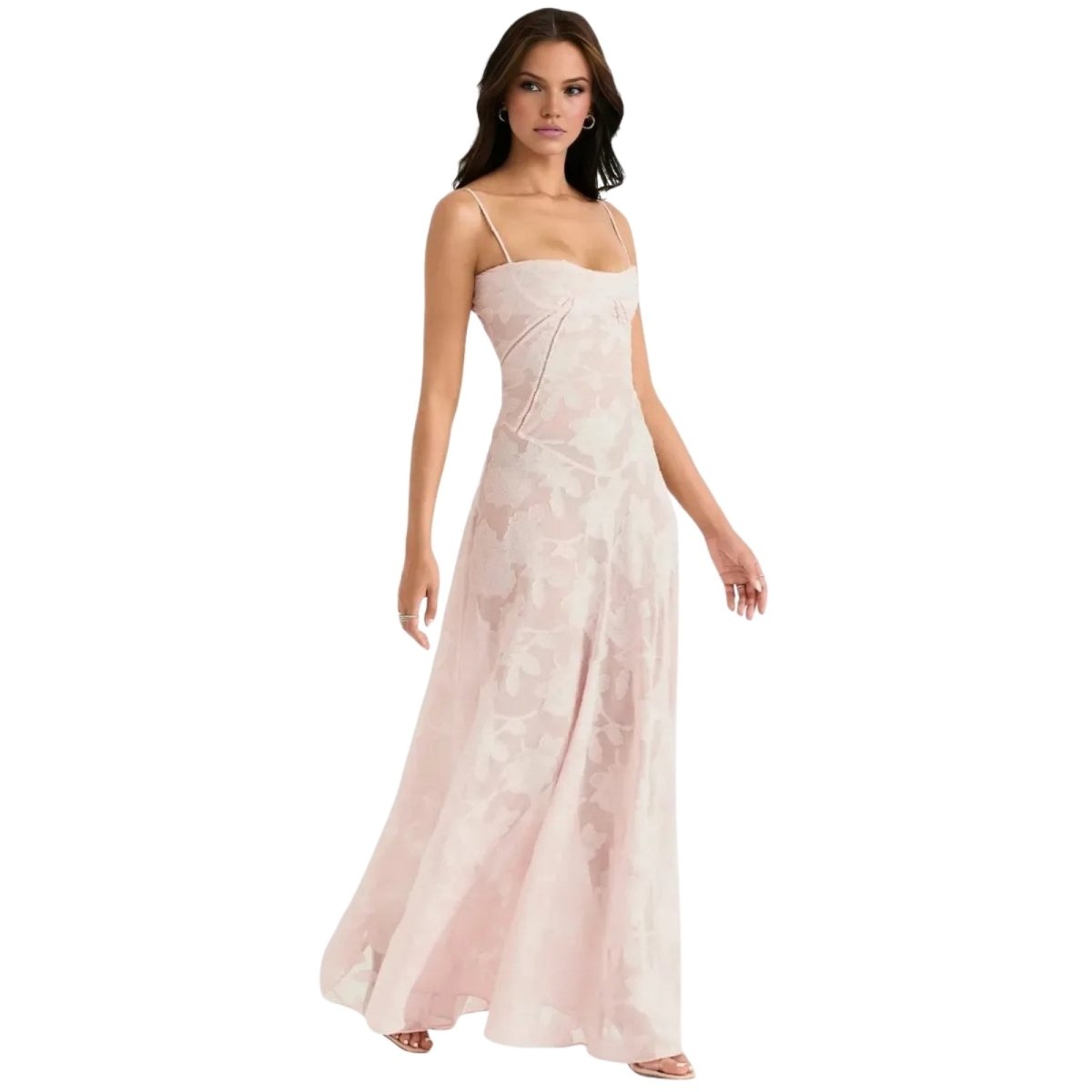 Woman wearing a light pink Kouvr strapless gown on a white background