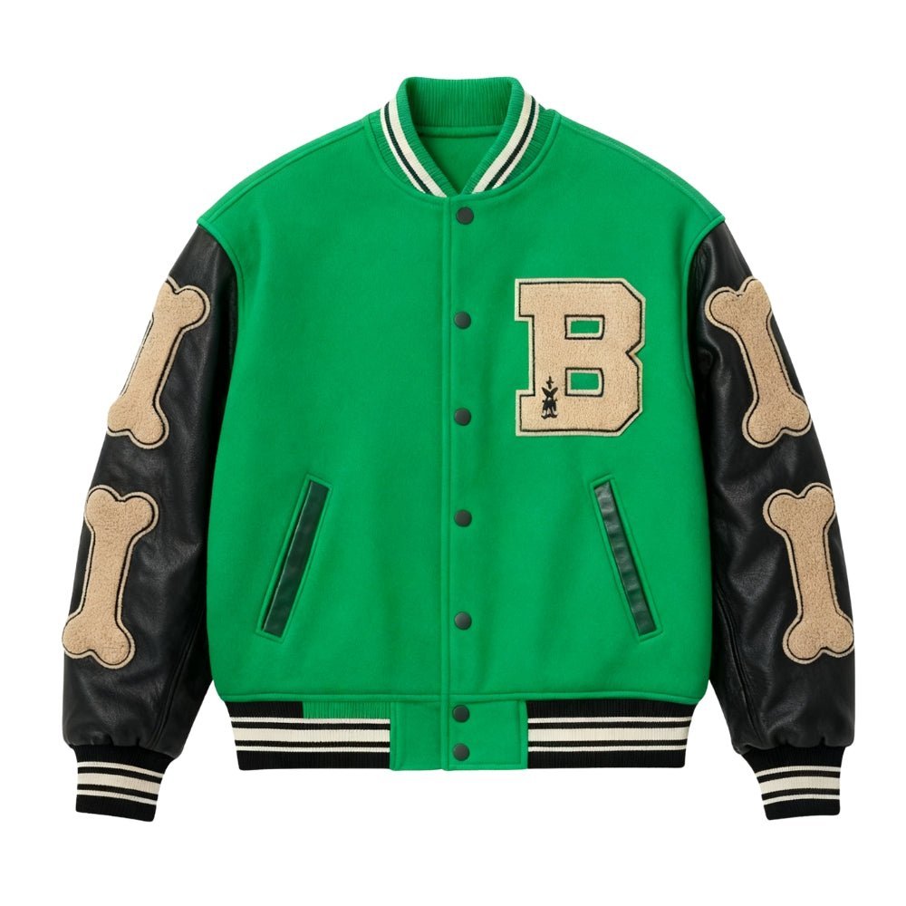 Green Kouvr varsity jacket with black sleeves featuring bone designs and a large 'B' logo on a white background.
