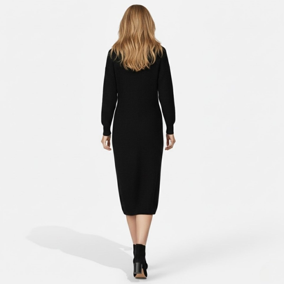 Back view of the Kouvr Fashion Janessa black knit midi dress, showing the clean lines and fitted silhouette.