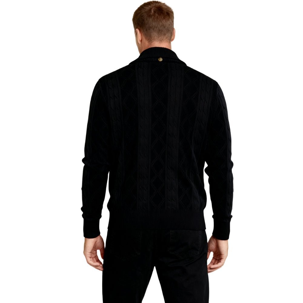 Man wearing a black kouvr  shirt and pants on a white background