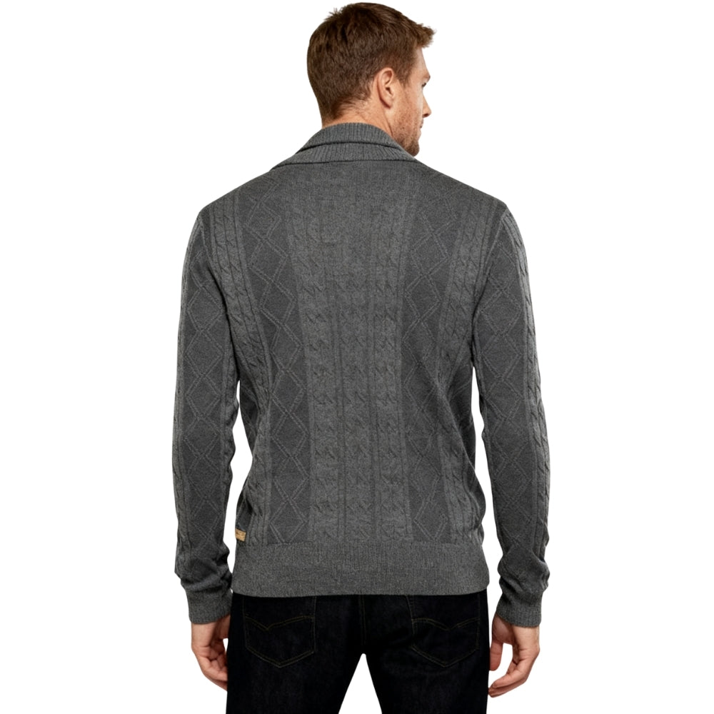 Man wearing a gray kouvr  patterned sweater on a white background