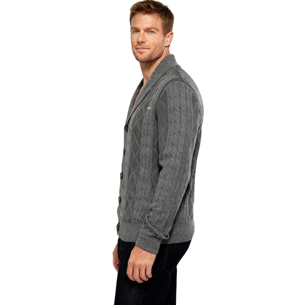 Man wearing a gray kouvr  cable knit cardigan on a white background