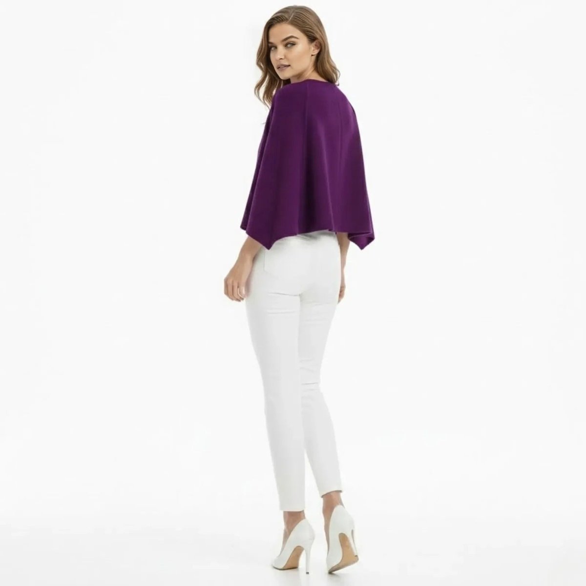 Back view of the Kouvr Fashion Laverne purple cape jacket on a model, showcasing the clean lines and minimalist design.
