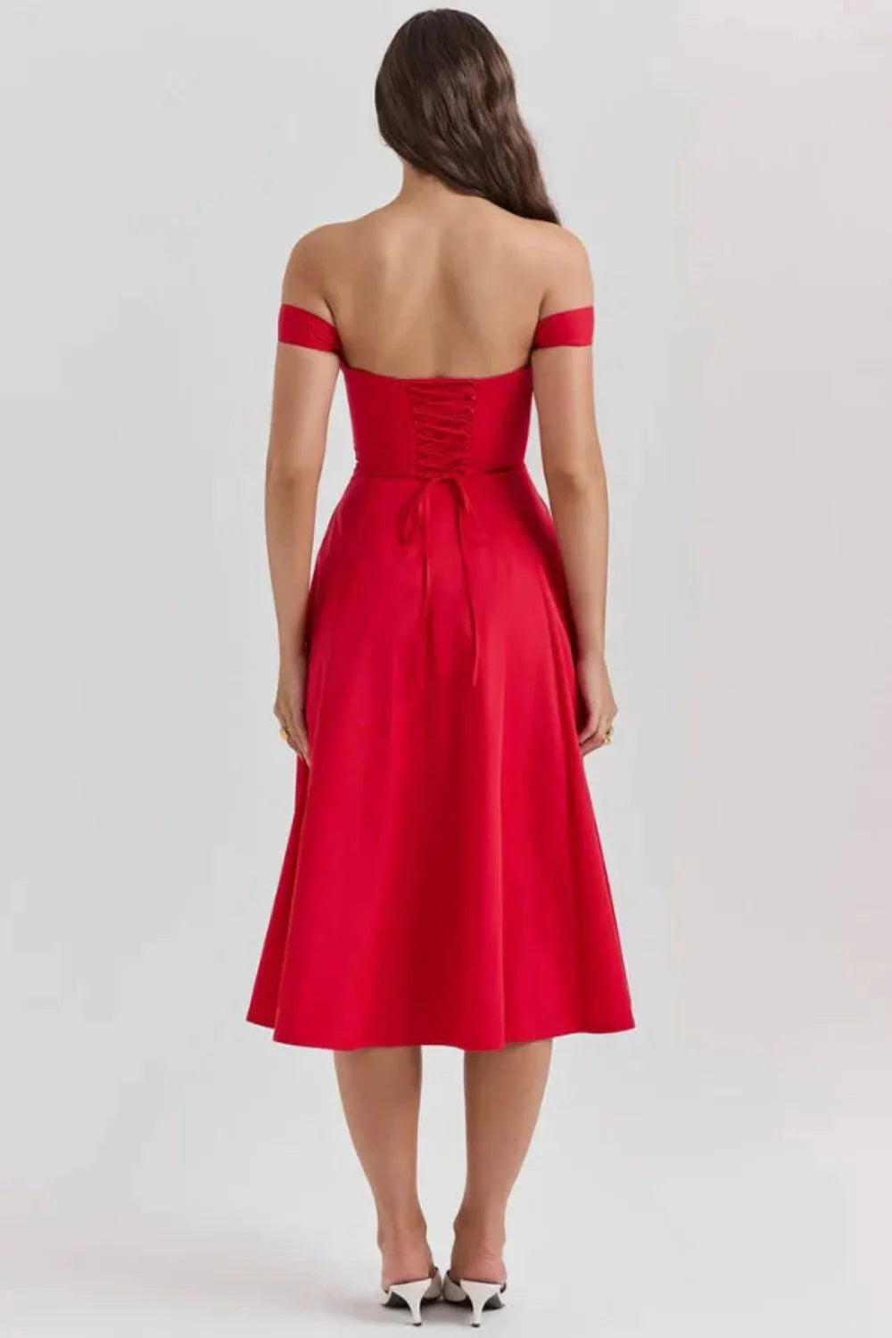 Bardot neckline, bustier dress, A-line skirt, thigh-high slit, lace-up back, wedding guest attire, structured bodice, statement dress