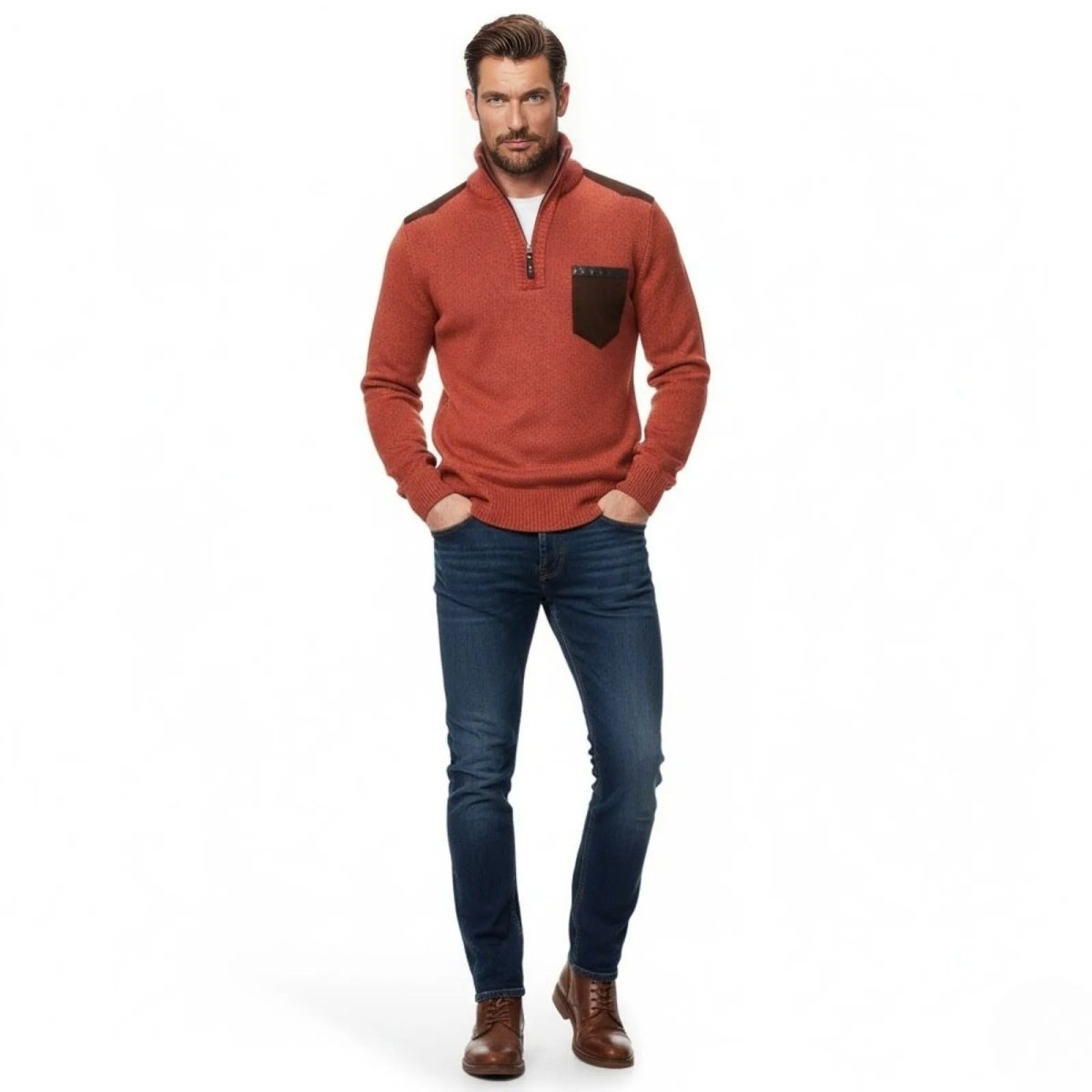 Man wearing the Kouvr Fashion Soren quarter-zip sweater in red orange with slim dark wash jeans and brown boots.