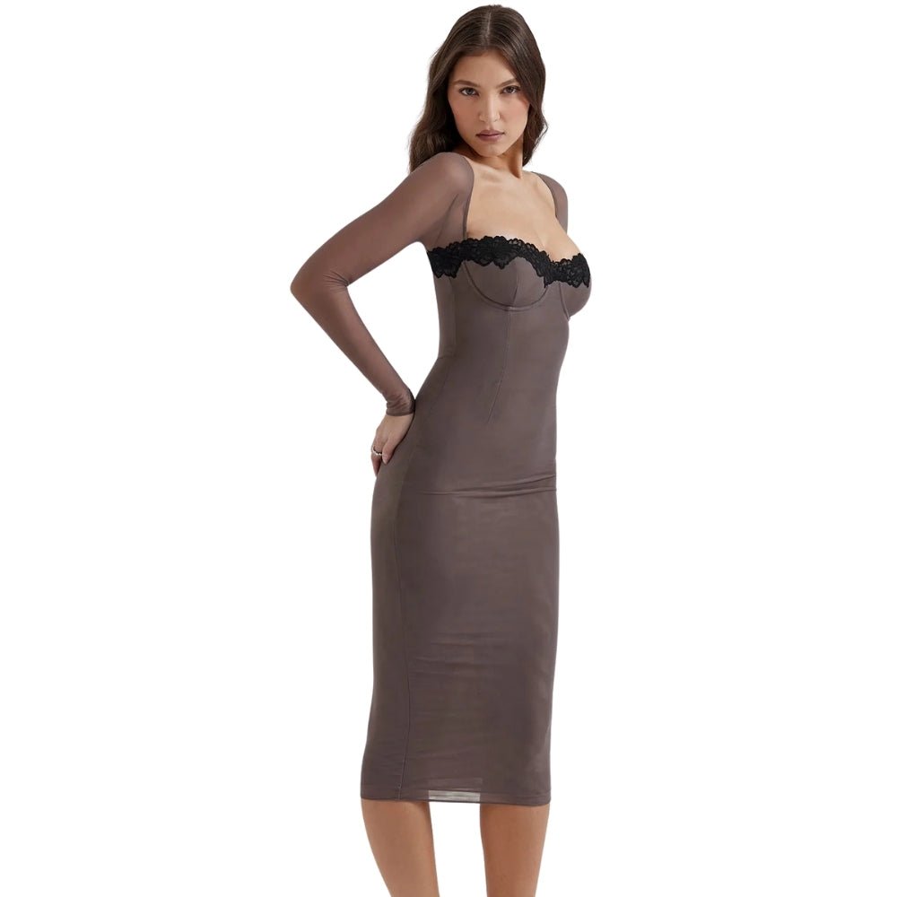 Woman wearing a taupe Kouvr slip dress with black lace trim on a white background