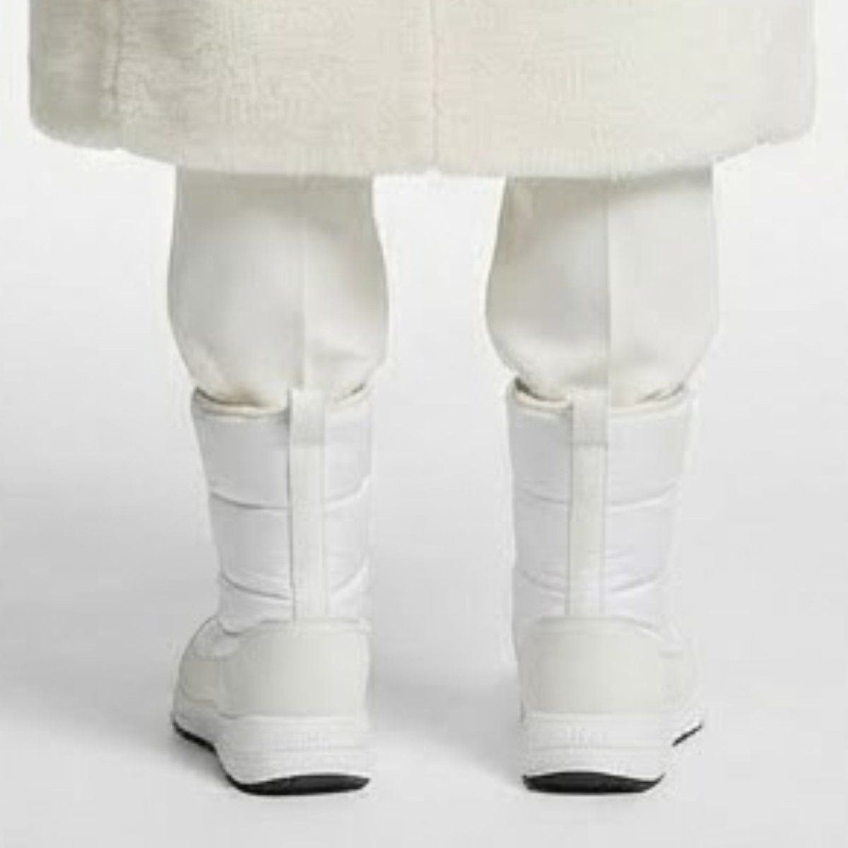 Back view of a pair of Kouvr gianna white insulated winter boots, highlighting the clean design and durable heel counter. 