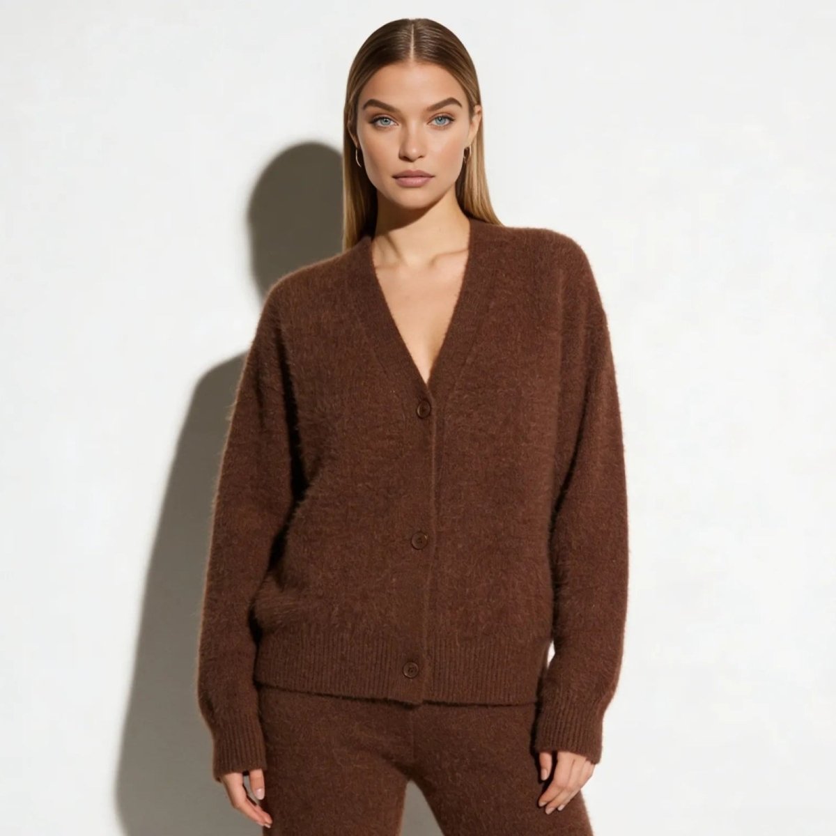 Model wearing the Kouvr Gina alpaca blend cardigan in a rich brown, styled as a loungewear set with a relaxed, open V-neck.