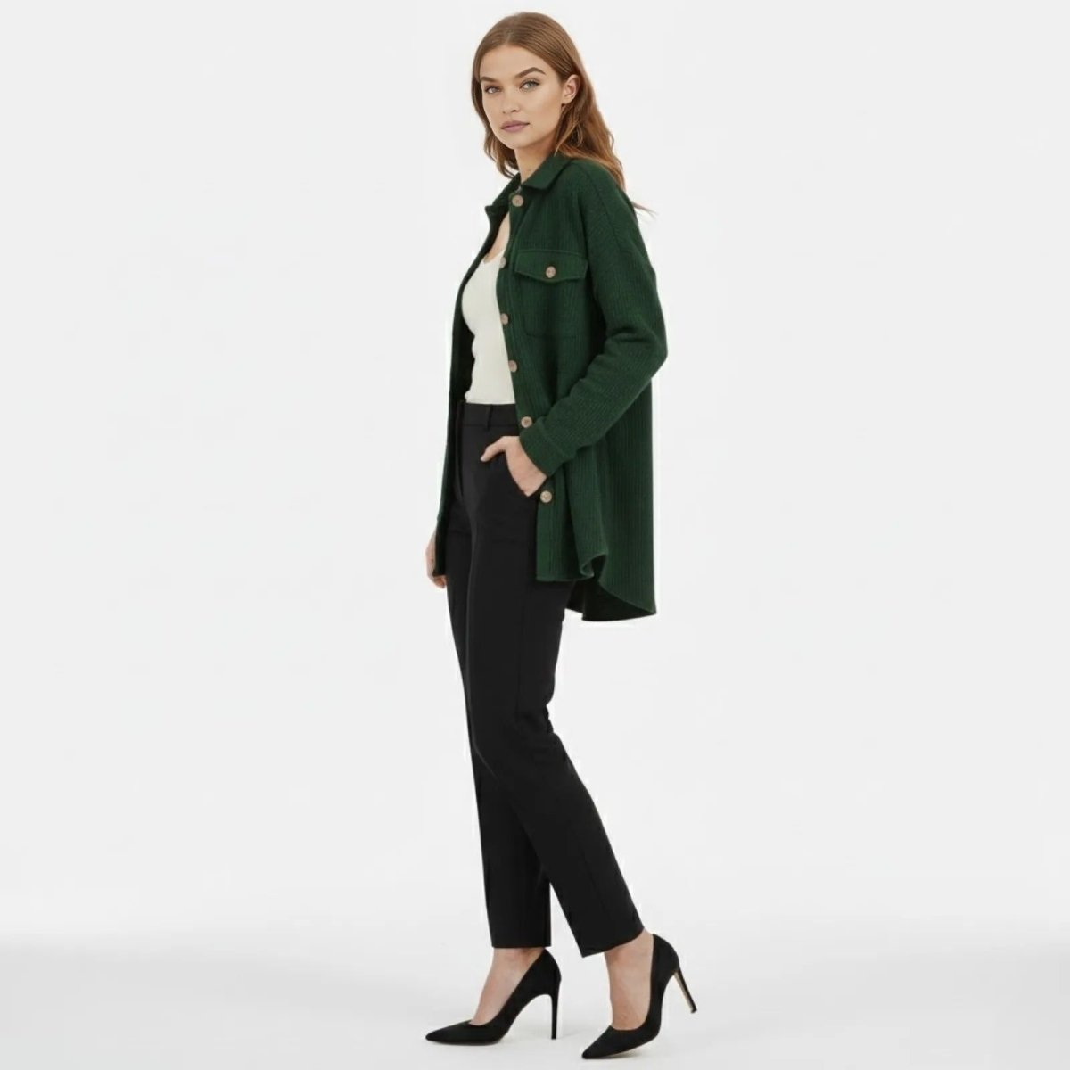 Side profile of a model wearing the  green waffle knit shacket, showing its longline silhouette and high-low hem.