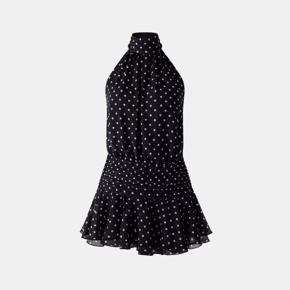 Flatlay image of the front of a black and white polka dot halter mini dress with a smocked waist.