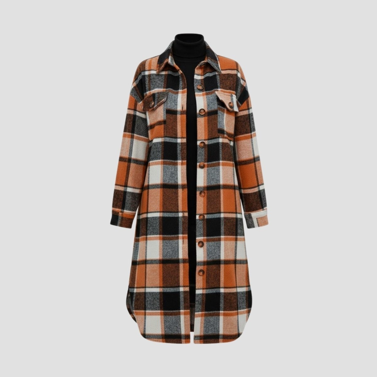Flatlay product shot of the Kouvr Janet Longline Plaid Shacket in orange, black, and white, showing the full buttoned-up front.