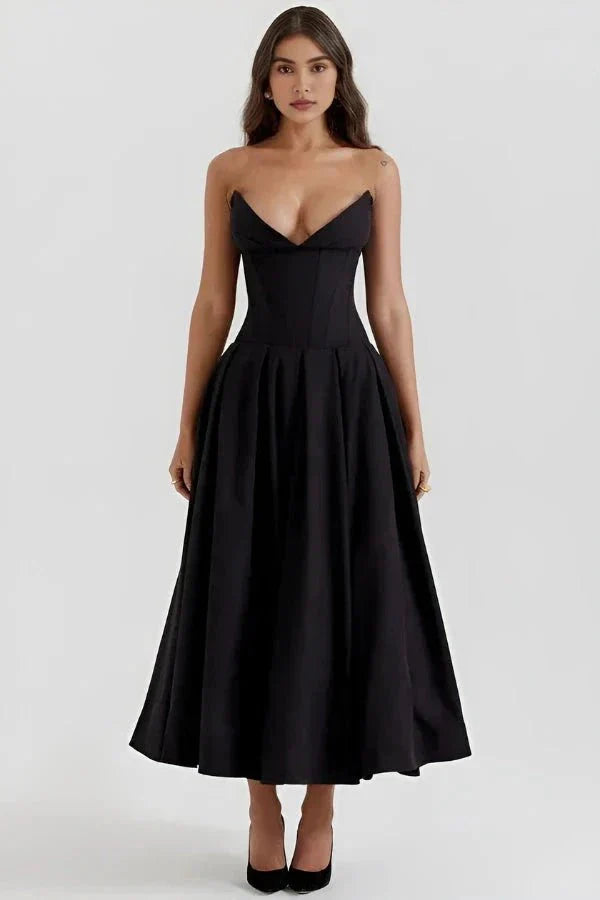 Model wearing Kouvr Fashion's black strapless corset midi dress for a formal event