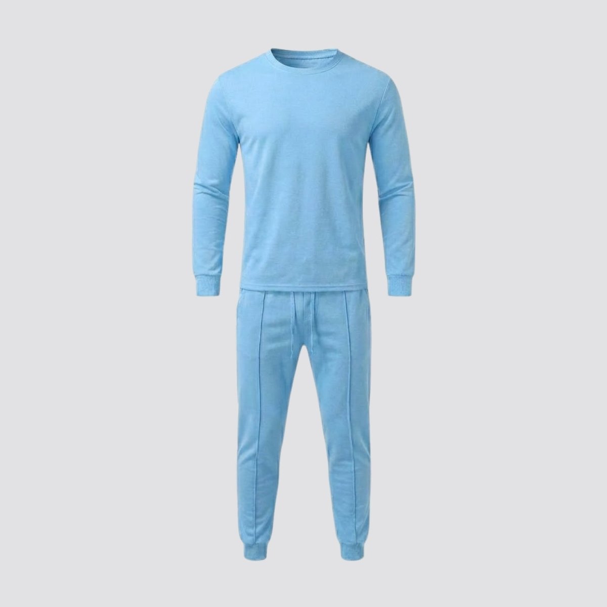 Front view flat lay of the Kouvr men's two-piece tracksuit in light blue, showing the crewneck sweatshirt and pintuck joggers.
